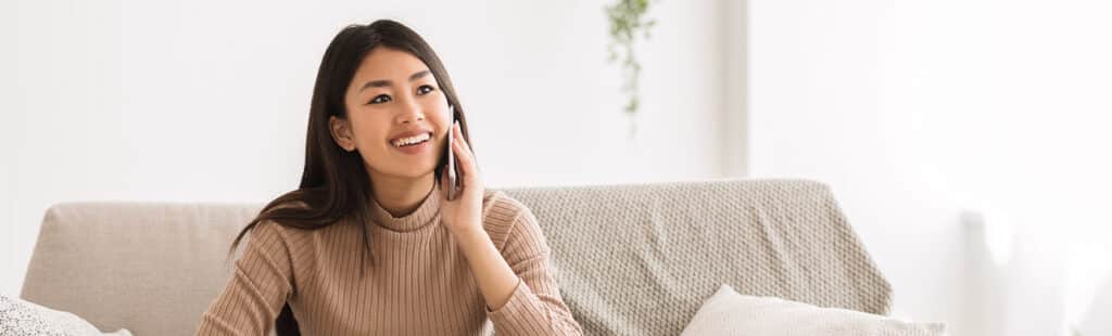 woman talking on the phone smiling