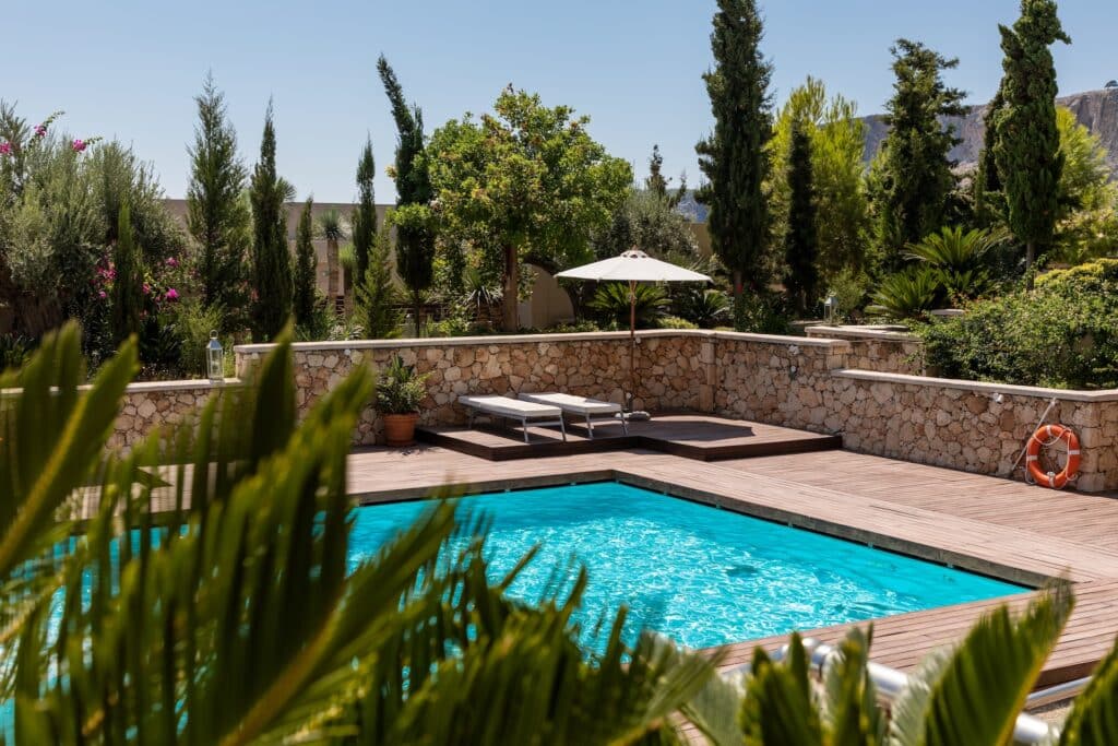 pool lined with palm trees