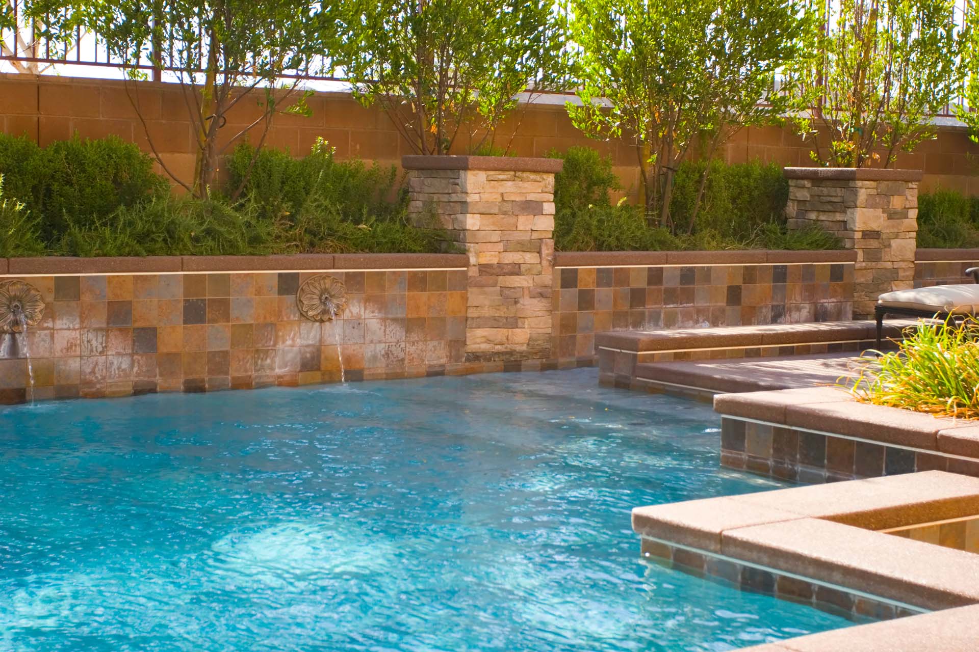 Pool with tan rock wall