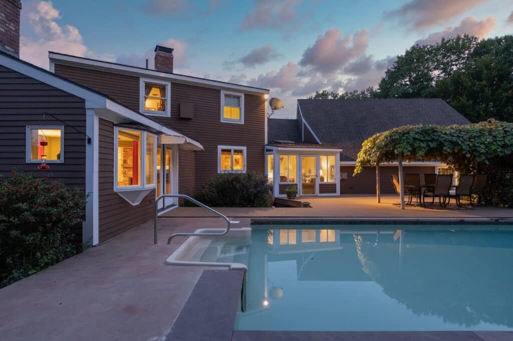 Corona home with backyard pool at dusk