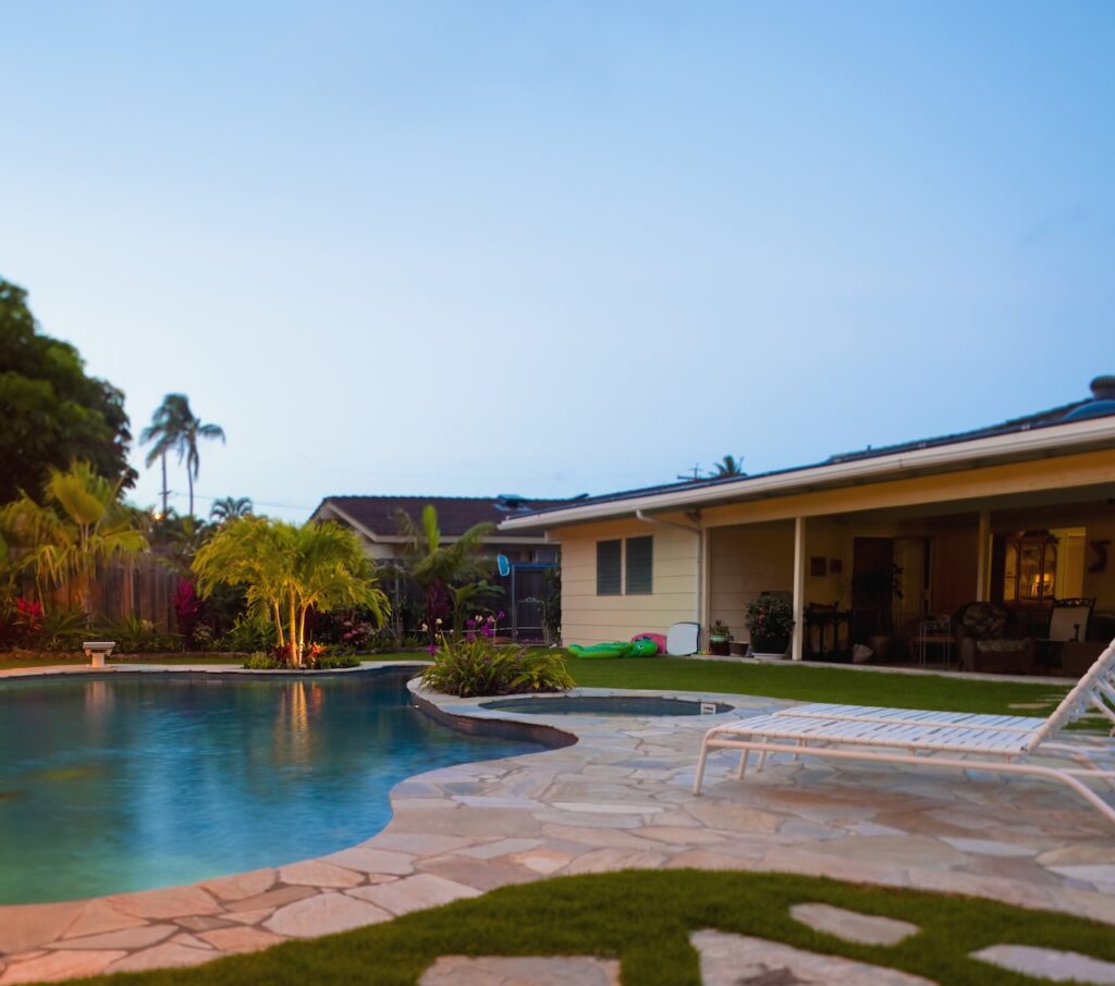 luxury backyard pool at sunset